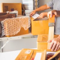 Team staff packed in brown boxes to deliver to customers